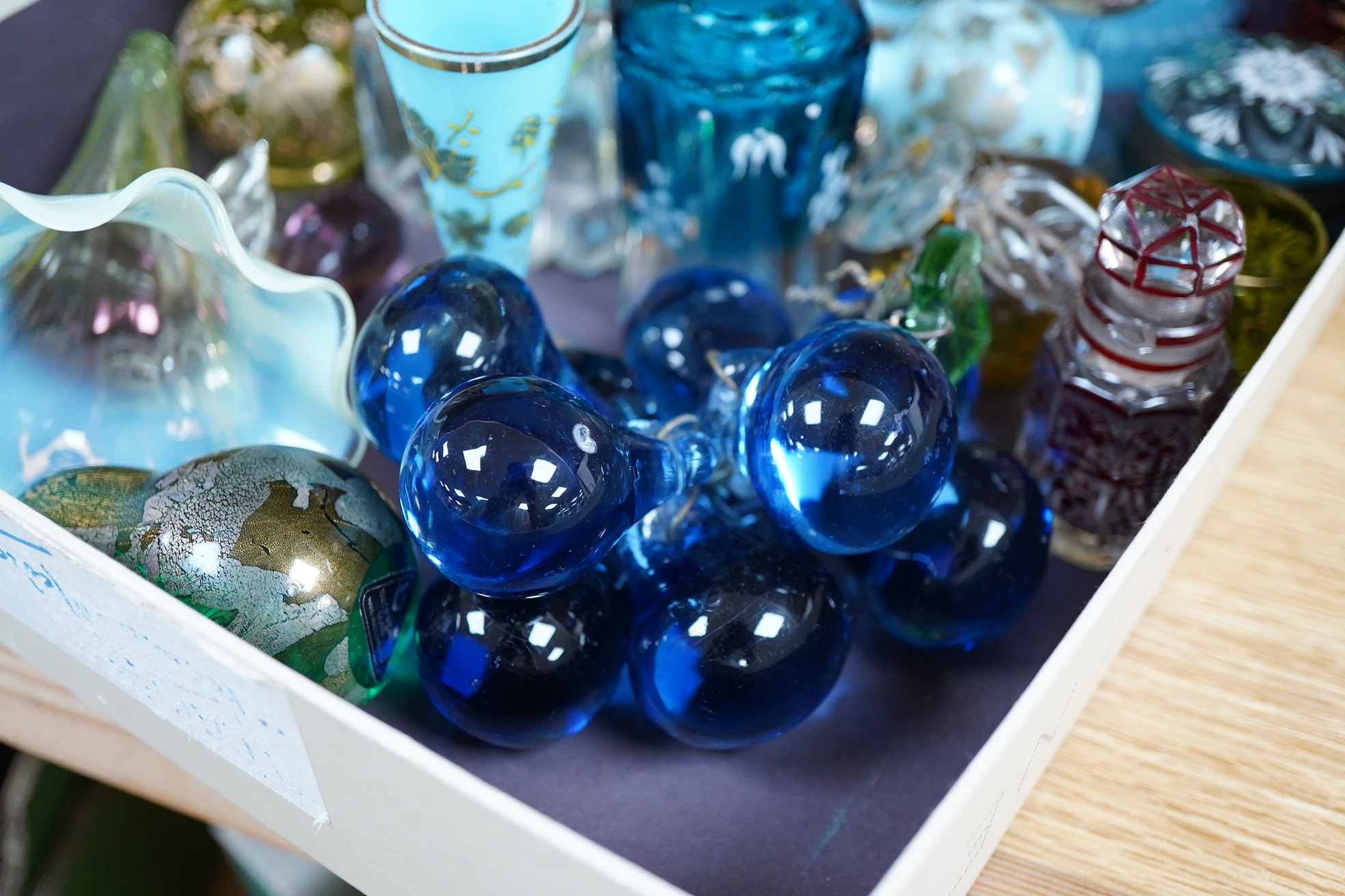 A collection of 19th century and later glassware to include gilt scent bottles, fruit ornaments and beakers, largest 14cm high